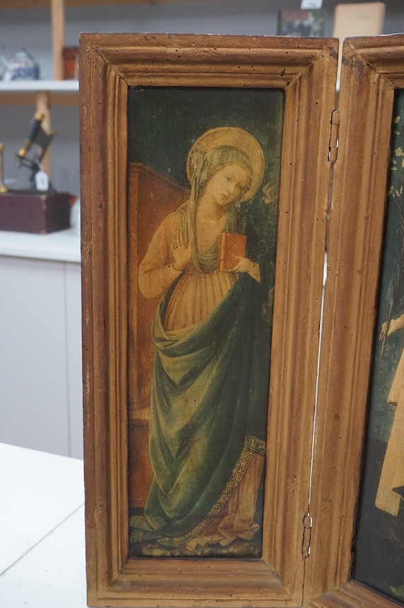 A diptych, colour prints, The Annunciation, overall 41cm high, housed in a folding gilt frame. Condition - fair